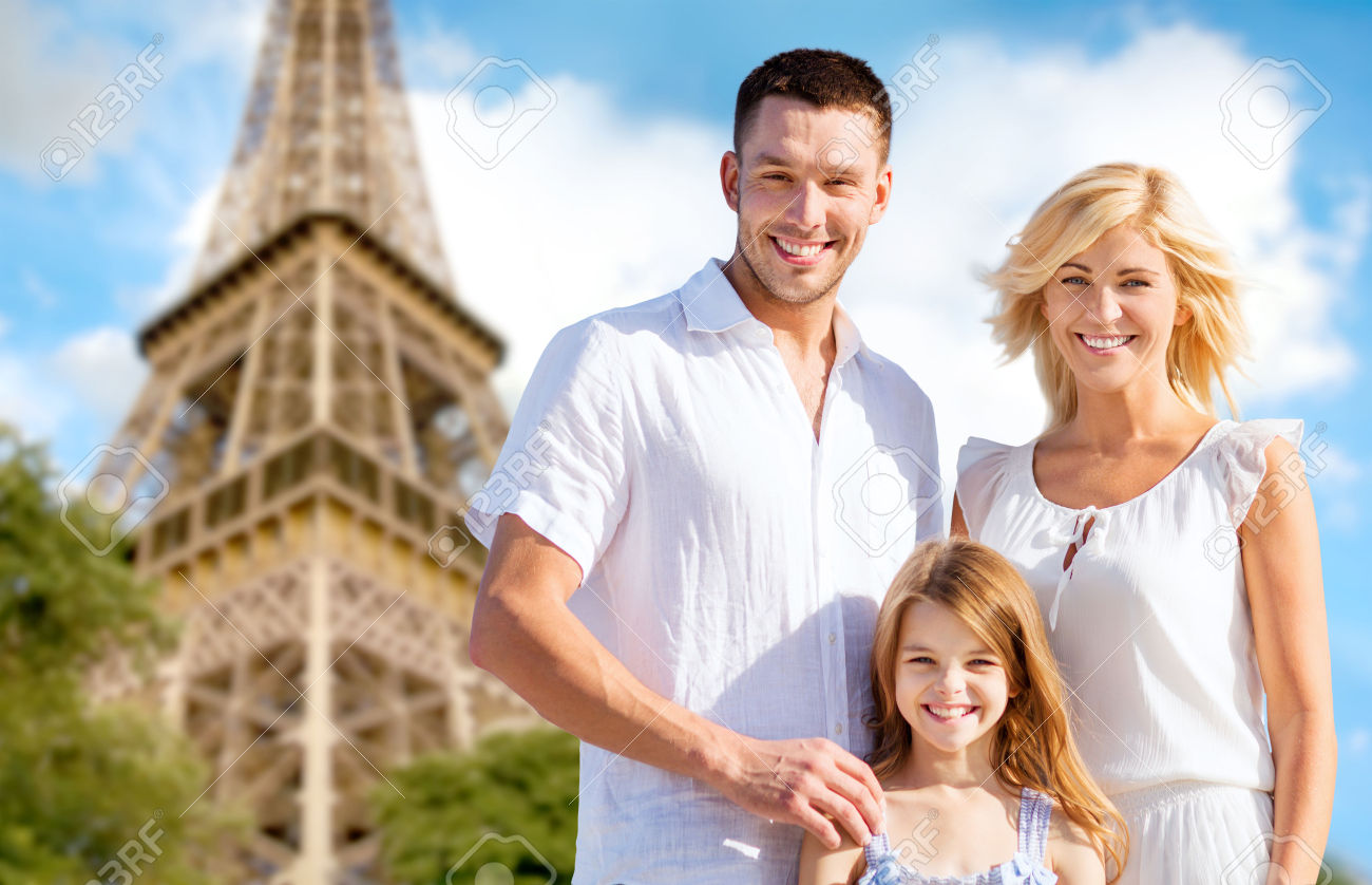 39649465-summer-holidays-travel-tourism-and-people-concept-happy-family-in-paris-over-eiffel-tower-background-Stock-Photo